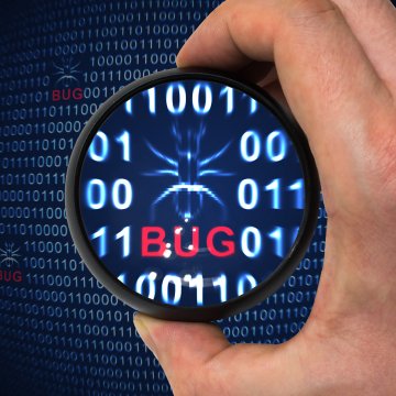 registry cleaners regclean pro hand with magnifying glass over red bug text in binary code 0 and 1